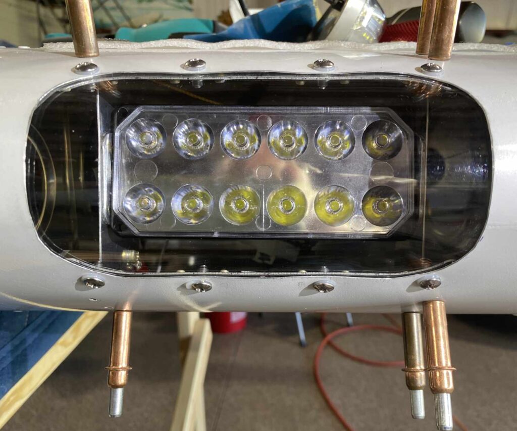 Van's Rv-12 landing light install with clecos holding rib mounts